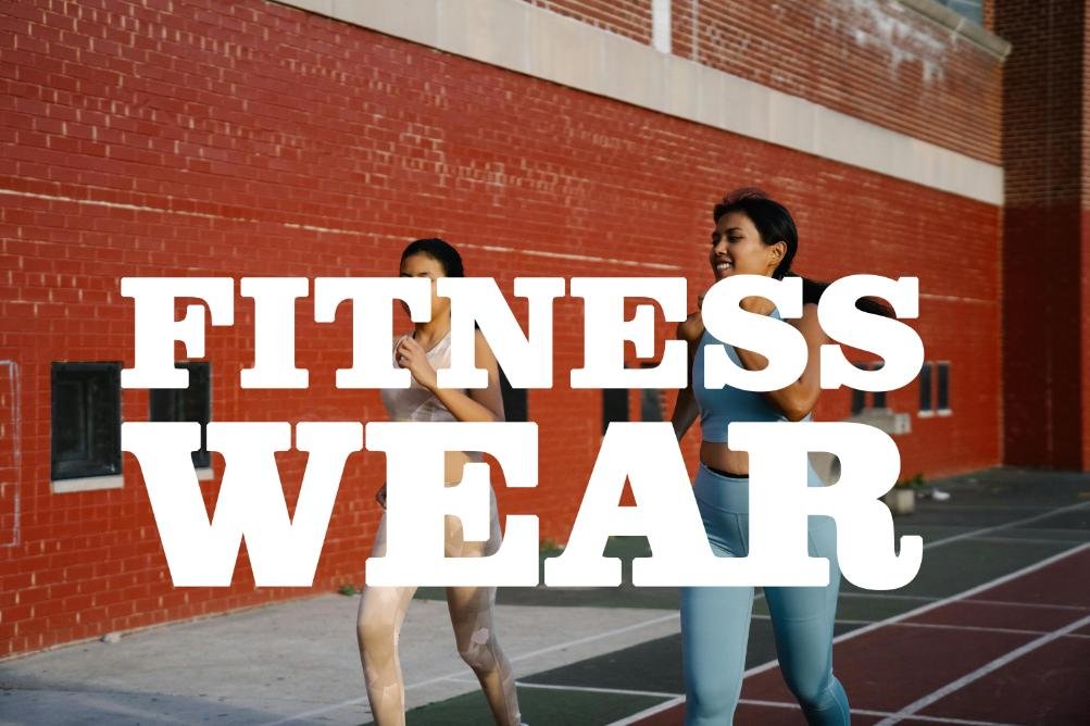 two runer suited in fitness wear dress and runing in street.